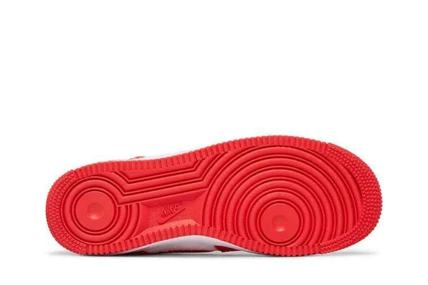 Red outsole of Nike Air Force 1 Low Valentine’s Day Fleece GS showing circular traction patterns