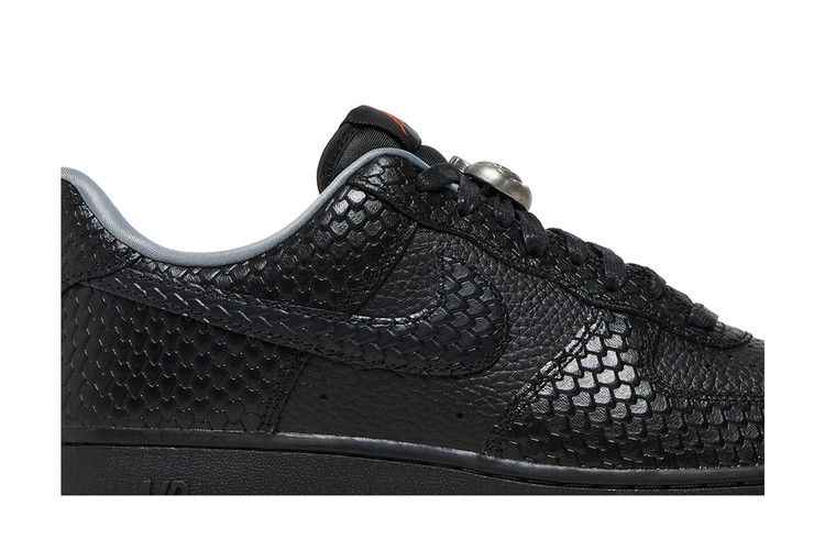 Close-up of the black scale-like texture and matching black Swoosh
